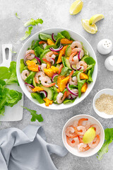 Shrimp, avocado and mango salad with fresh green lettuce. Prawn salad