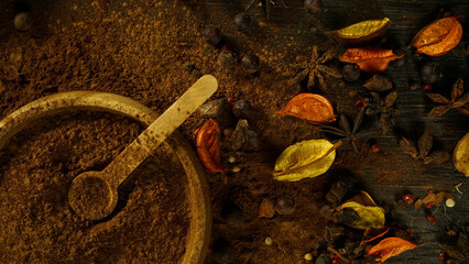 cinnamon ground sticks ceremony cocoa cloves ground coffee spices on wooden table closeup