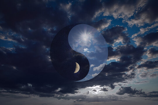 Ying Yang symbol against cloudy sky. Feng Shui philosophy