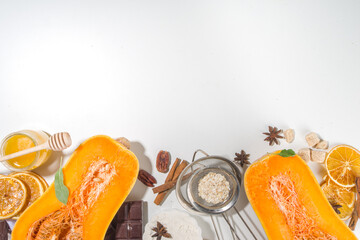 Pumpkin tart pie baking ingredients with honey, sugar and seeds on white table, fall time baking background