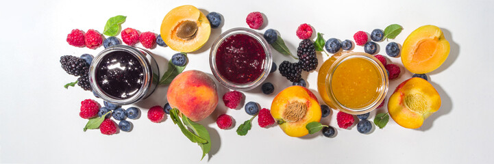 Assortment of berries and fruits jams in jars