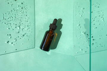 Top view of glass face serum bottle.