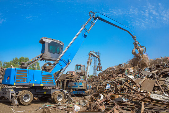 scrap metal grab on a bright sunny day