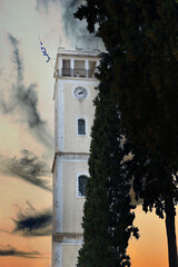 The clock tower of Komotini in Greece, sunset cloudy sky