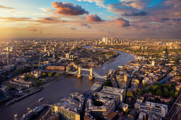 Beautiful, panoramic sunset view of the skyline of London with Tower Bridge along the river Thames...