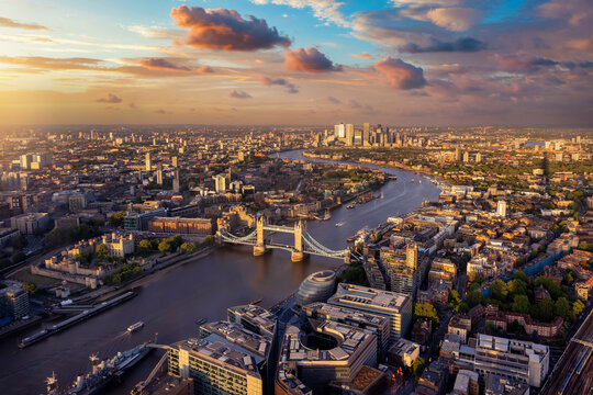 Beautiful, panoramic sunset view of the skyline of London with Tower Bridge along the river Thames until Canary Wharf, England