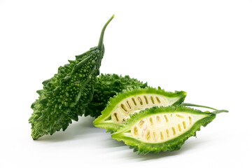 whole and bitter melon or bitter gourd slices isolated on white background.fresh vegetable