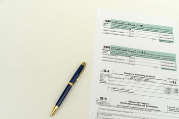 tax forms for filing a declaration by citizens of the state are on the table next to the pen