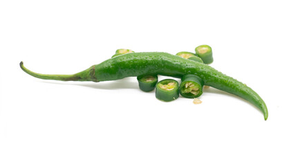 whole and some pieces of green chili pepper isolated on white background