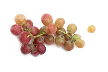 Red grapes placed on a white background, View from above