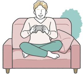 Young western man sitting on the living room sofa playing video games alone