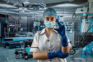 Fototapeta na wymiar woman doctor in medical uniform with a protective mask and gloves and look for vaccine