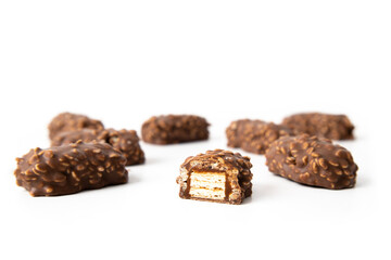 Chocolate candy bars wafers handmade lie on a white background