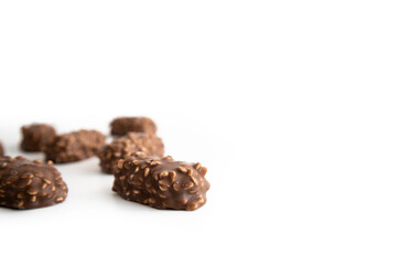 Chocolate candy bars wafers handmade lie on a white background