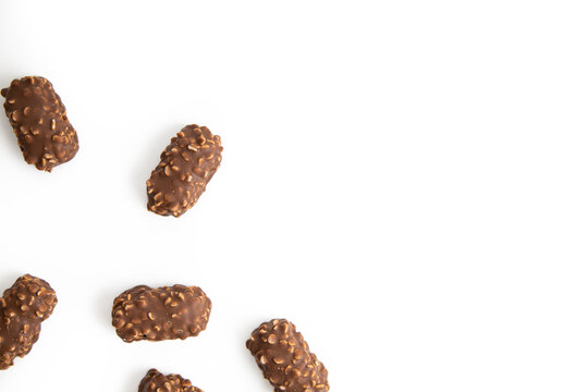 Chocolate candy bars wafers handmade lie on a white background. Top vew, flat lay