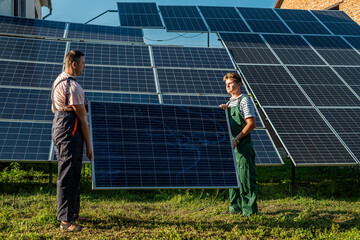 Foreman and engineer installing  solar photovoltaic panels