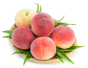 Pink and yellow Peach fruit with leaf on white background, Fresh Sweet Peach on wooden basket.