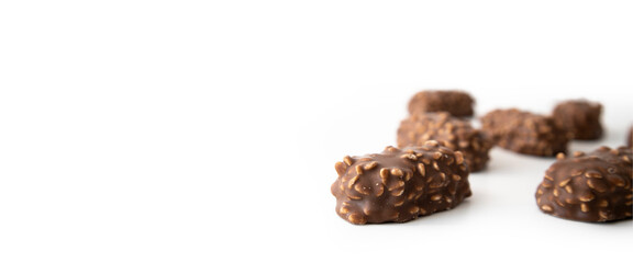 Chocolate bars with handmade wafers lie on a white background. Banner