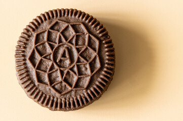 cocoa biscuits with vanilla filling on an orange background
