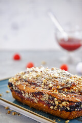 Home pound cake with lemon and strawberry filling on a blue plate