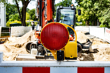 a warning lamp with an excavator