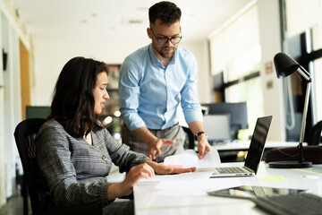 Colleagues arguing in office. Angry businessman yelling at his collegue