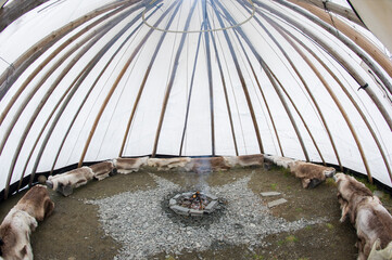 Tipi tent in Norway, with a bonfire © goyoconde