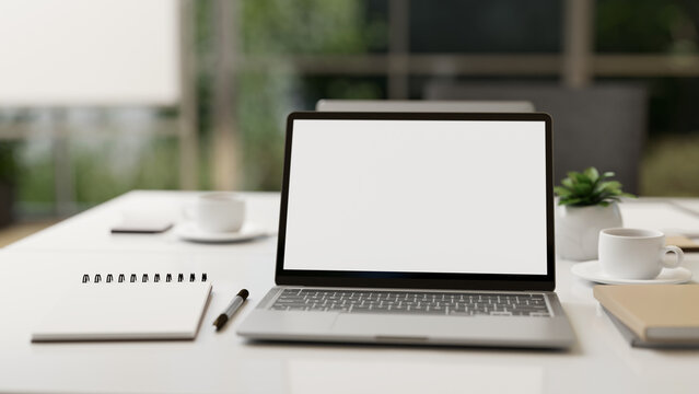 Modern office desk workspace or co-working space with portable laptop computer mock-up