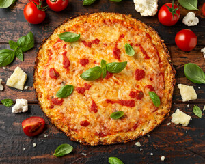 Homemade cauliflower crust pizza with tomato sauce, cheese and basil. Healthy diet food