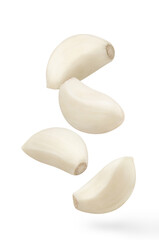 Flying delicious garlic cloves,  isolated on white background