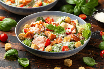 Salmon Caesar salad with grilled fish, croutons and cherry tomatoes