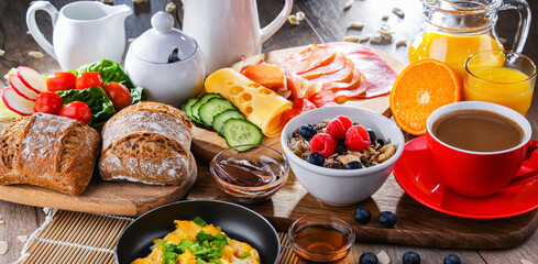 Breakfast served with coffee, scrambled eggs, cereals and ham