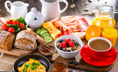 Breakfast served with coffee, scrambled eggs, cereals and ham