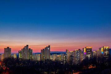 Obraz premium Scenic view of city scape against sky during sunset