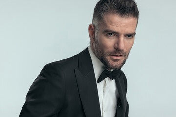 businessman looking away with a tough look on his face