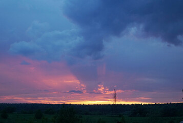 Beautiful sunset and power tower. Blue Pink Yellow Orange