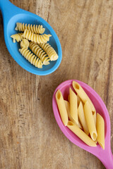 variety of pasta and kitchen ladles