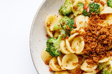 orequette pasta with broccoli on a white background