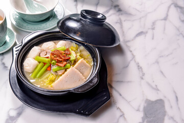 A pot of Shanghai fish balls, fish fillet mixed vegetable soup