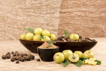 Indian Gooseberry fruits on an old wood background.