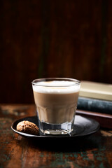 Coffee with milk on dark wooden background. Soft focus. Copy space.	