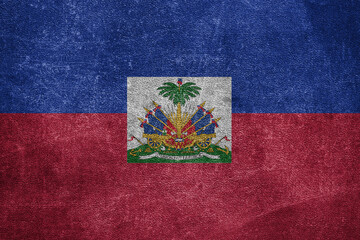Old leather shabby background in colors of national flag. Haiti