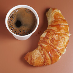 Croissant and coffee cup