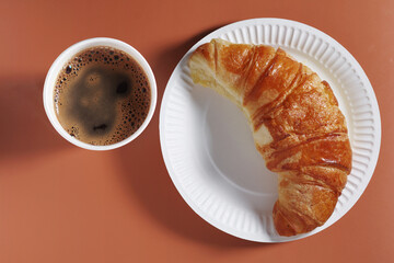Croissant and coffee cup