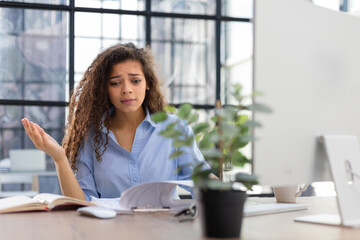 Worried frustrated businesswoman shocked by bad news, stressed businesswoman troubled with financial problem.