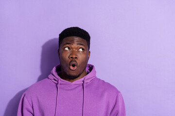 Portrait of attractive funny amazed guy thinking copy space pout lips isolated over bright violet lilac color background