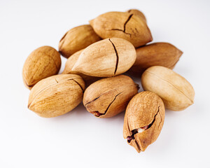 delicious fresh pecans on a white acrylic background