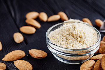 almond flour on a black wooden rustic background