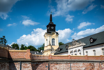 Fototapeta na wymiar The Potocki Palace in Radzyń Podlaski during the summer holidays against the backdrop of beautiful clouds