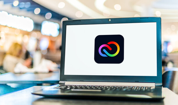 Laptop computer displaying logo of Adobe Creative Cloud Express